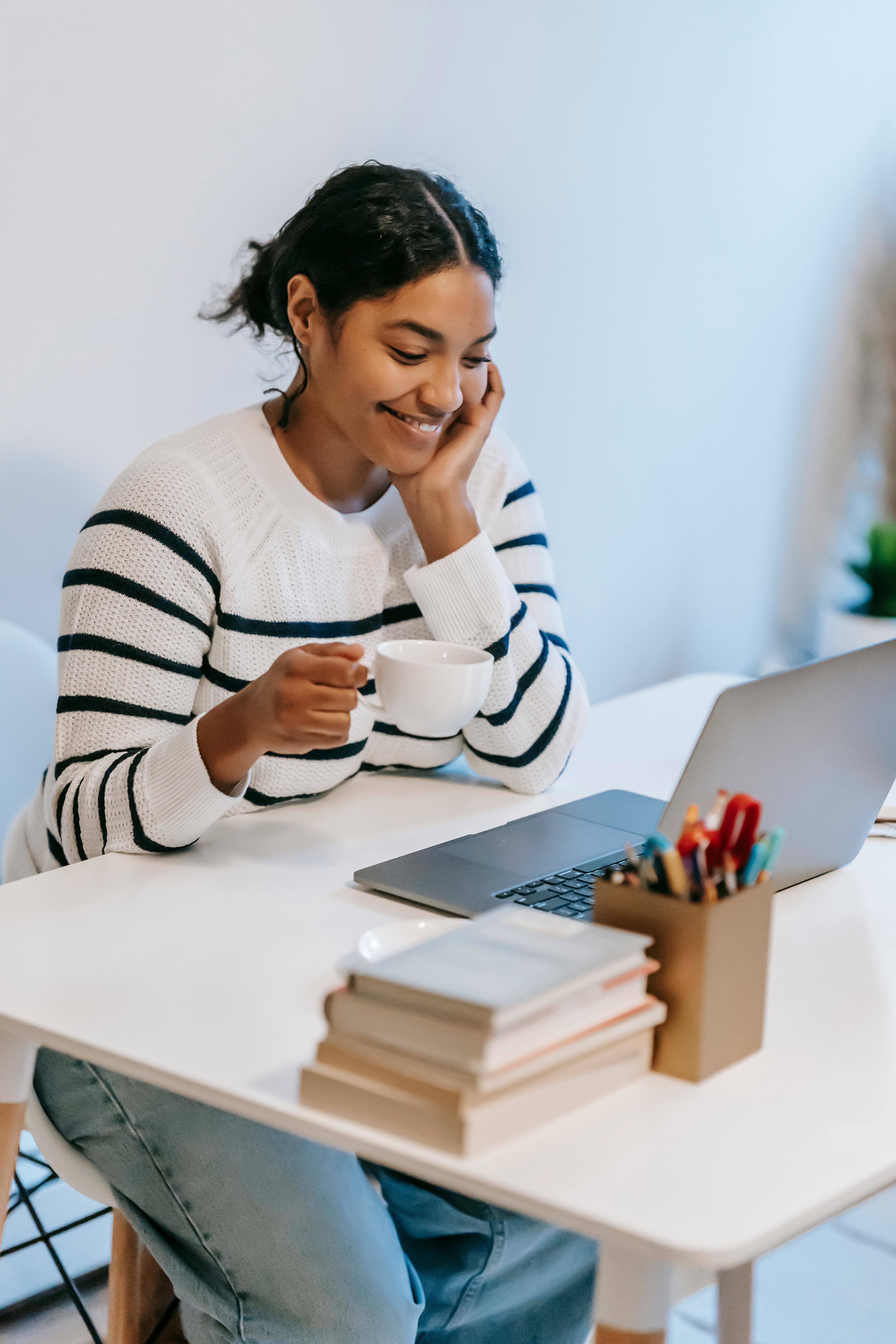 Cybersecurity professional working on a laptop at a desk. 