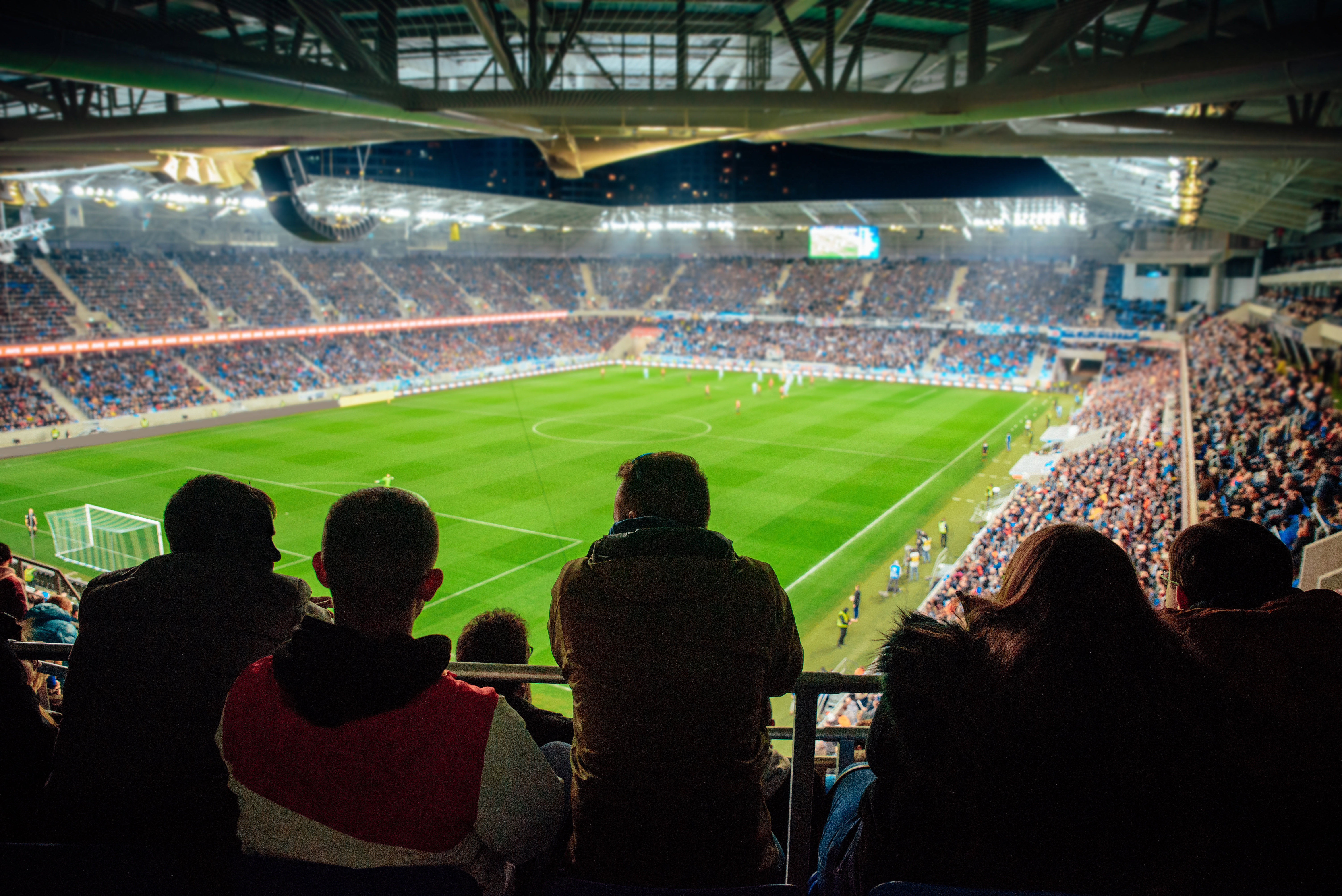 View inside a football stadium, mid match. 